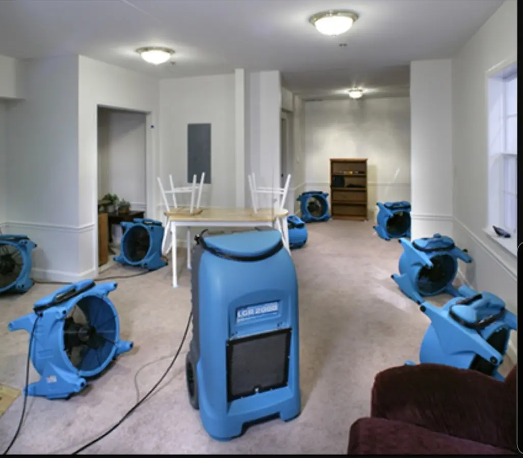Air movers and dehumidifier setup for Water Damage Restoration in Halfway